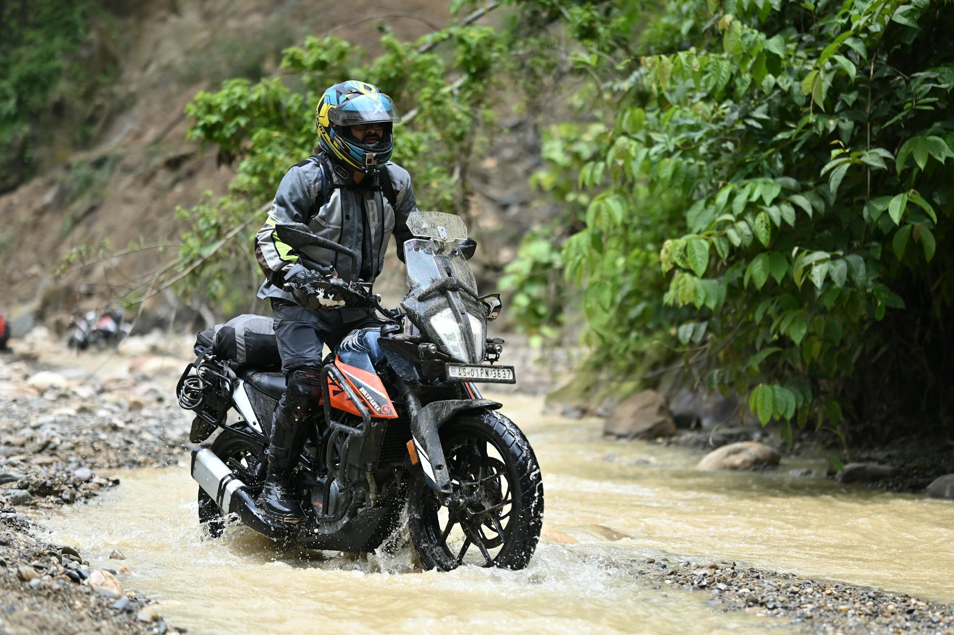 woman in motorcycle boots navigating terrain