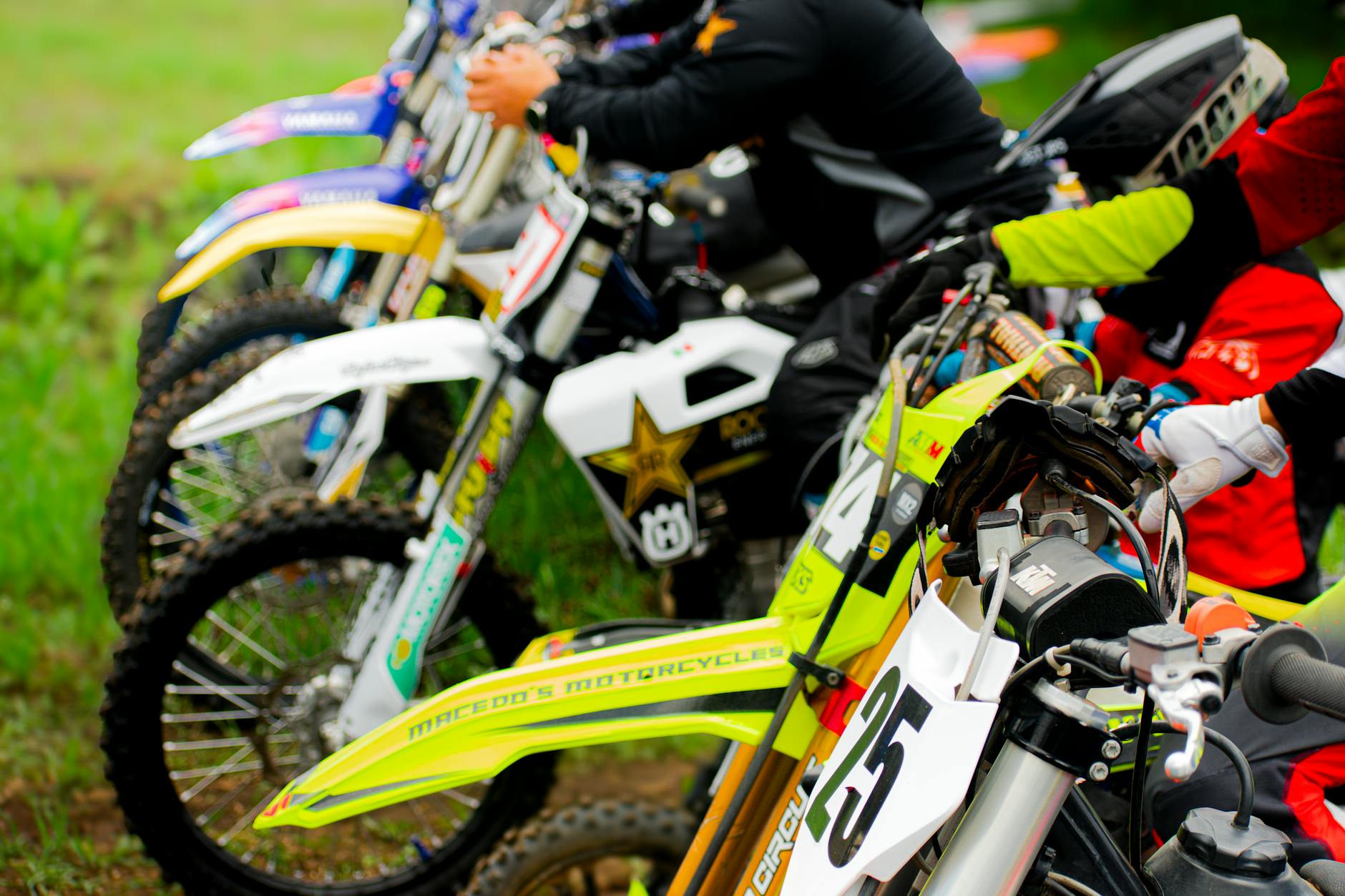Close-up comparison of different women's motorcycle helmet types: full-face, half, and modular