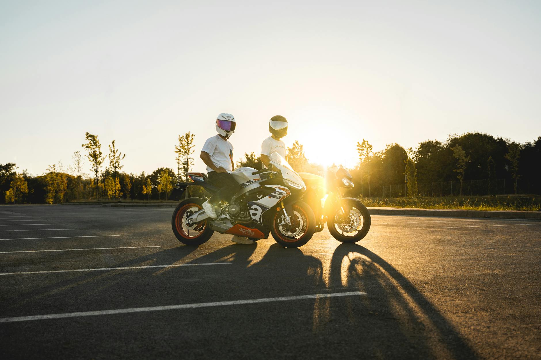 Group of riders wearing motorcycle pants during a sunset ride