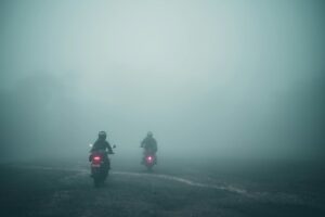 Motorcycle helmet visor fogged up while riding in cold weather, illustrating why fogging is dangerous