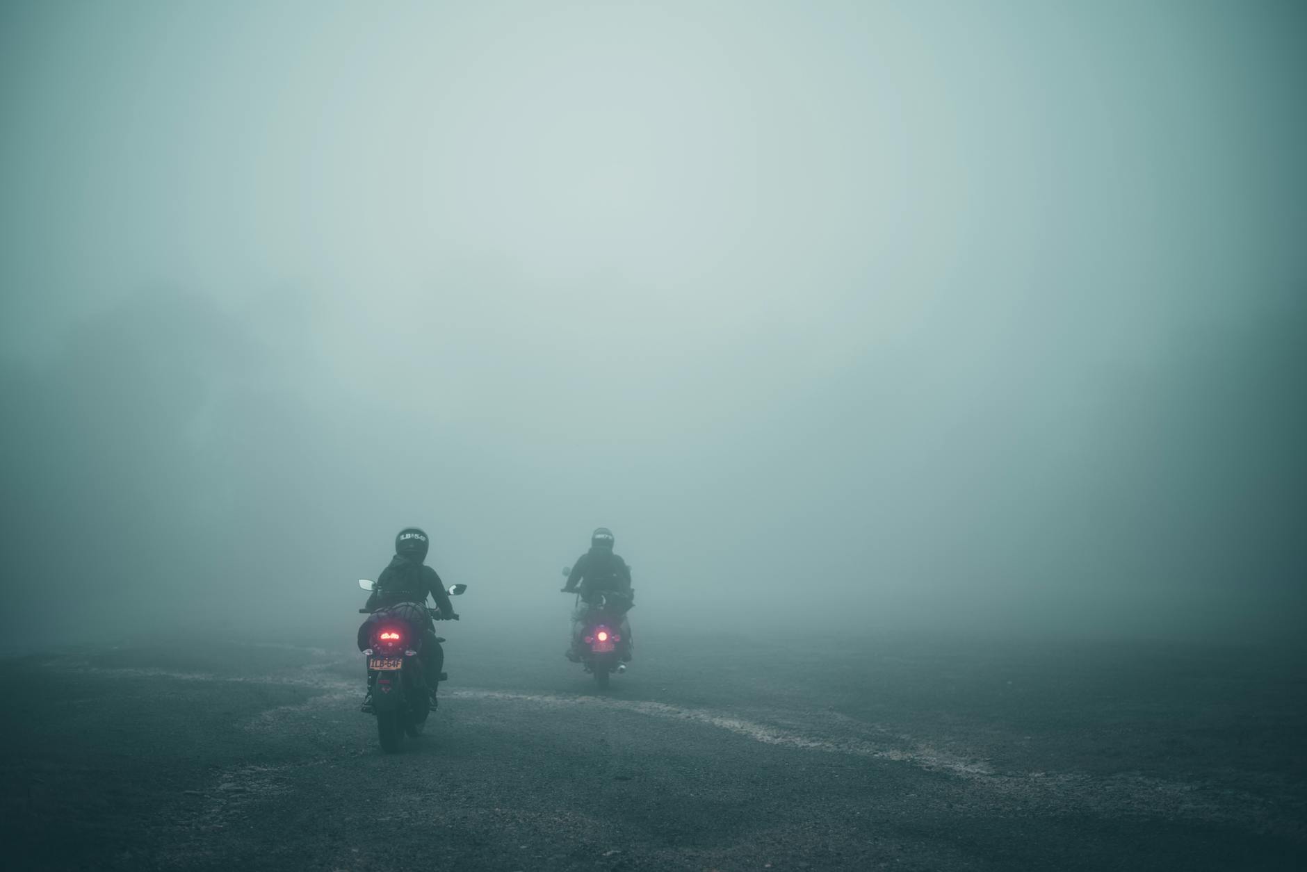 Motorcycle helmet visor fogged up while riding in cold weather, illustrating why fogging is dangerous